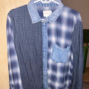 Blue/ jean colored flannel bottom down. Lightweight.